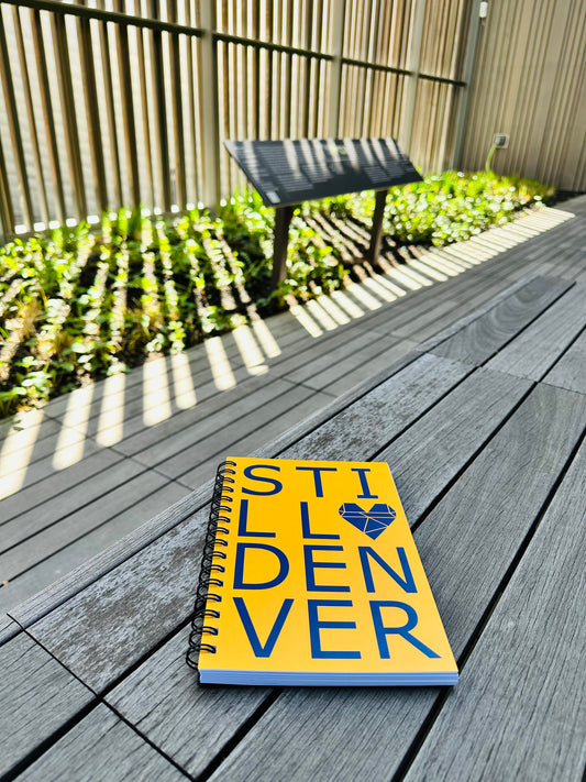 Photograph of Still Denver Notebook on floor.