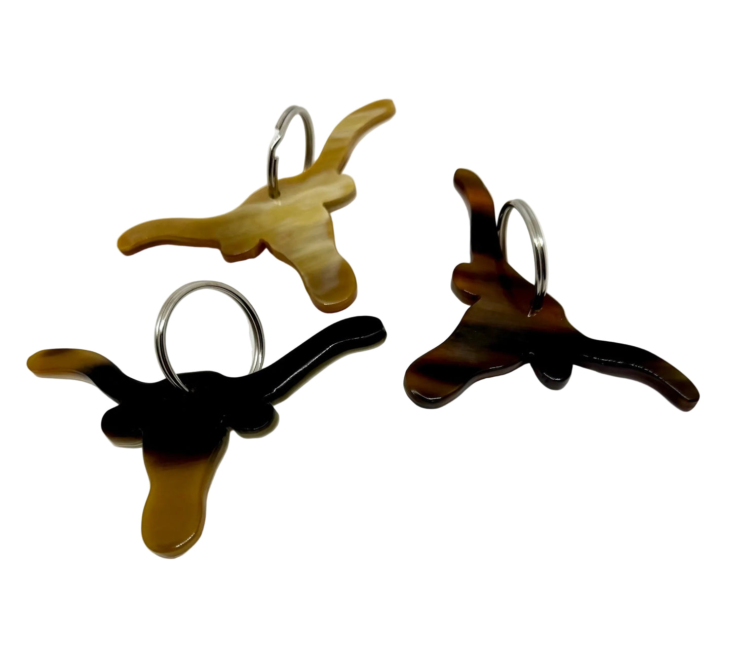 Three longhorn steer keychains on a white background