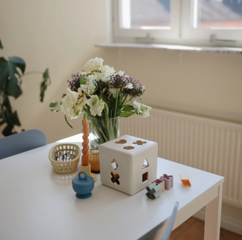 Photo of the Shape Sorting Box on a table.