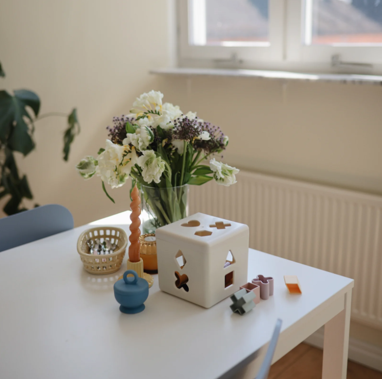 Photo of the Shape Sorting Box on a table. 