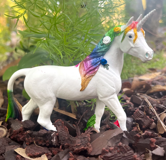 Colorful unicorn figurine with a rainbow mane and tail