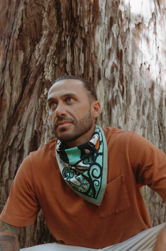 Man wearing a bandana around his neck