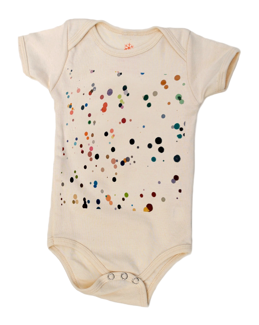 Beige baby onesie with colorful dot pattern on a white background.