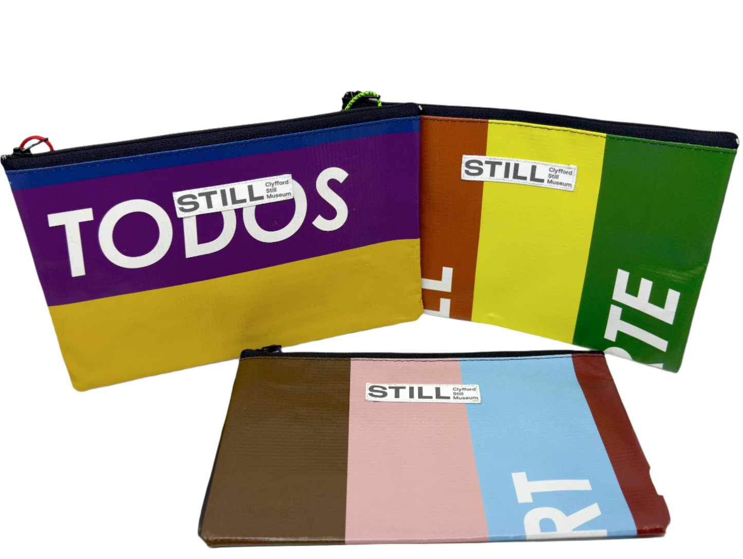 Colorful pouches with 'STILL' branding on a white background