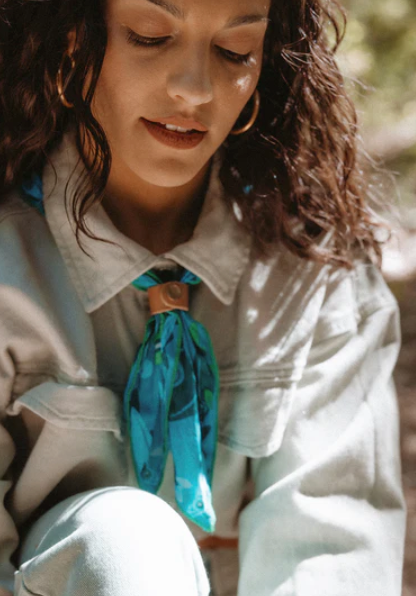 Woman wearing a clasped bandana around her neck
