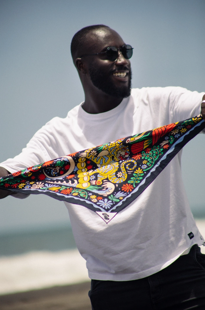 Man holding a colorful bandana