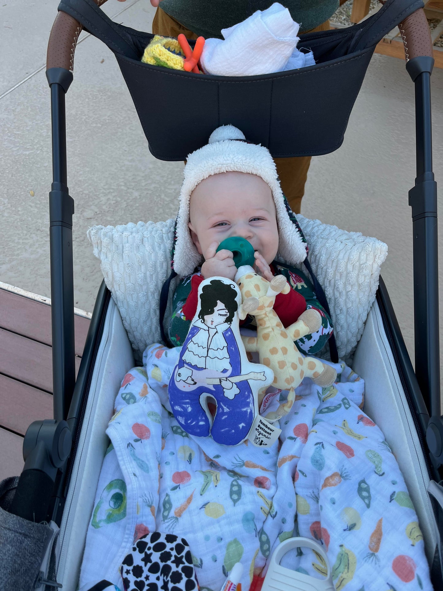 Photo of a child with a Prince rattle.