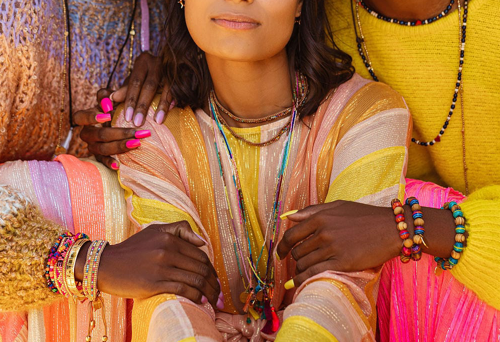 Close-up photo of 3 women wearing Bali Unity Beaded Jewelry