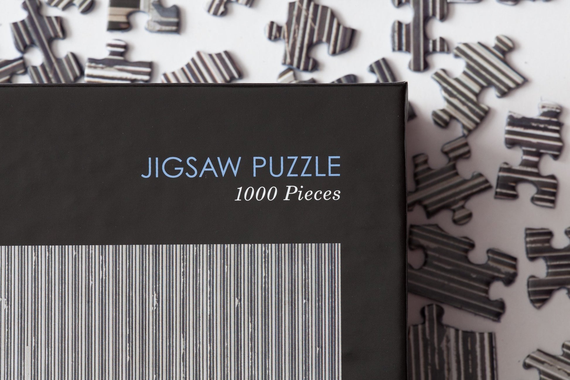 Text Displaying "Jigsaw Puzzle 1000 Pieces" on Jigsaw Puzzle, Clyfford Still Museum.