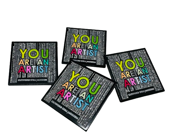 Image of four "You are an Artist" pins.