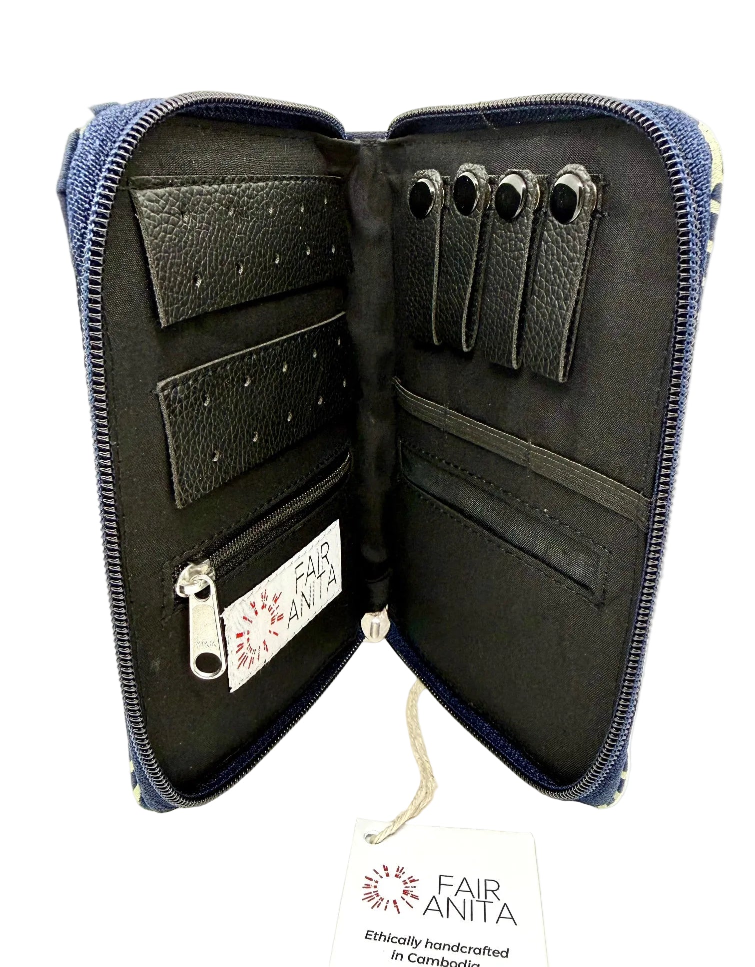 Open jewelry pouch with black exterior, featuring Fair Anita branding, on a white background.