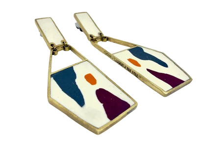 Pair of earrings with geometric design on a white background
