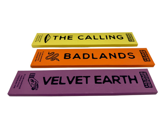 Three colorful rectangular packages of incense with text 'The Calling', 'Badlands', and 'Velvet Earth' on a white background.