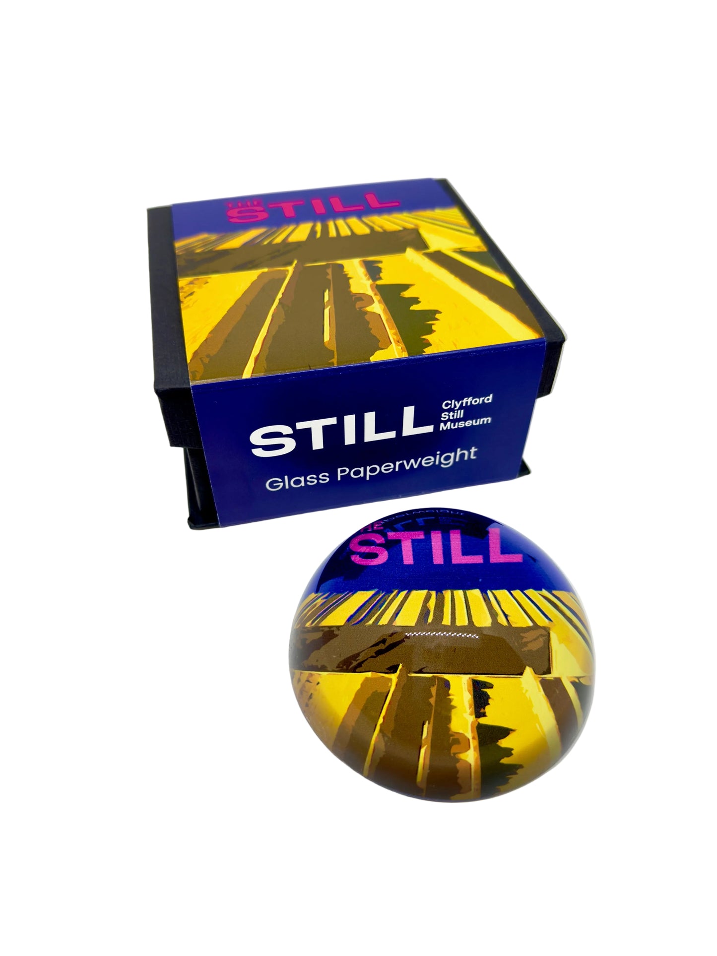 Glass paperweight with the building facade and 'STILL' branding on a white background.