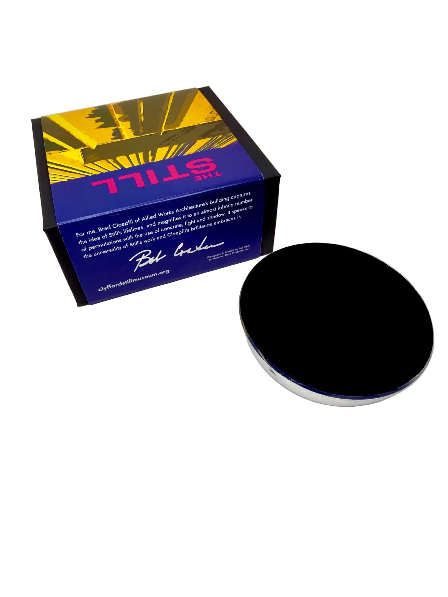 Paperweight upside down with a colorful box labeled 'STILL' on a white background