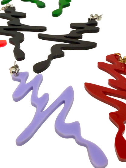 Colorful abstract earrings on a white background