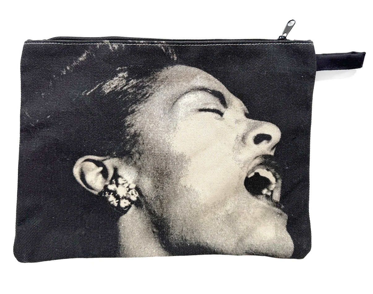 Pouch with a black and white graphic of a woman's face  singing on a white background