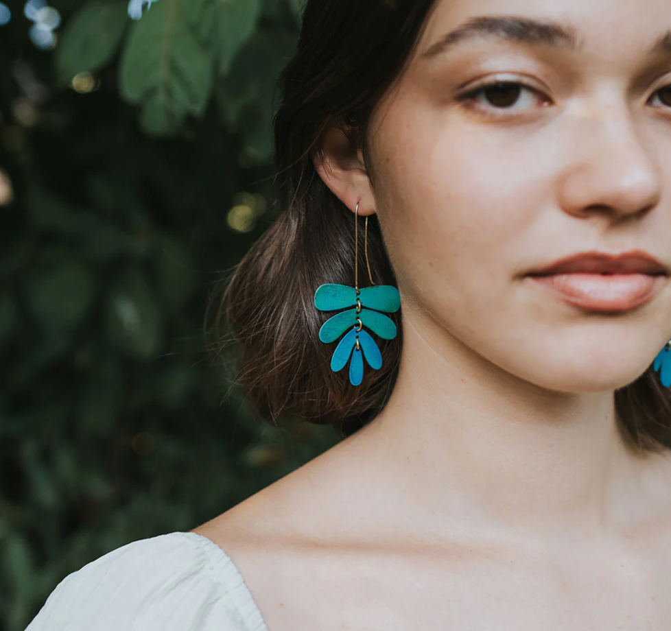 Woman wearing Matr Boomie ‘Chameli dangling leaf earrings/ teal patina’ 