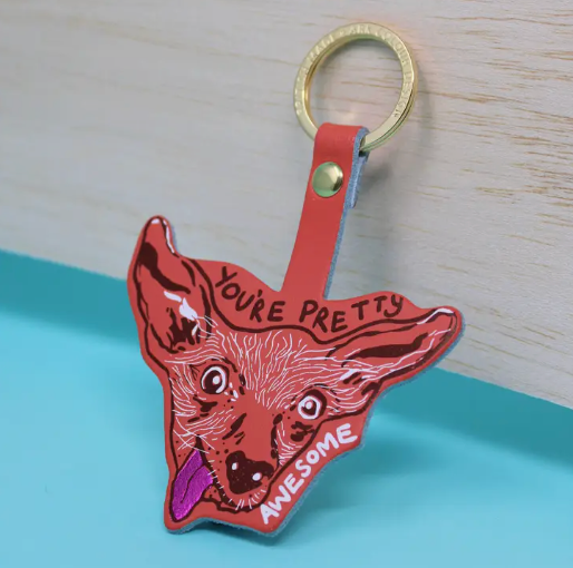 Leather Chihuahua key fob in coral with  “You’re Pretty Awesome” text.