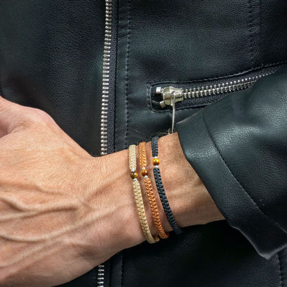 A close-up photo of a man wearing three Macrame Bracelets.