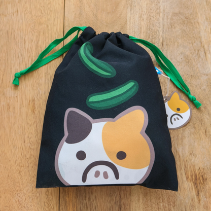 A travel-friendly, cute, versatile drawstring pouch bag with a cucumber cat.