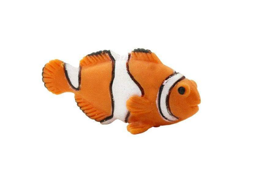 Plastic clownfish toy on a white background.