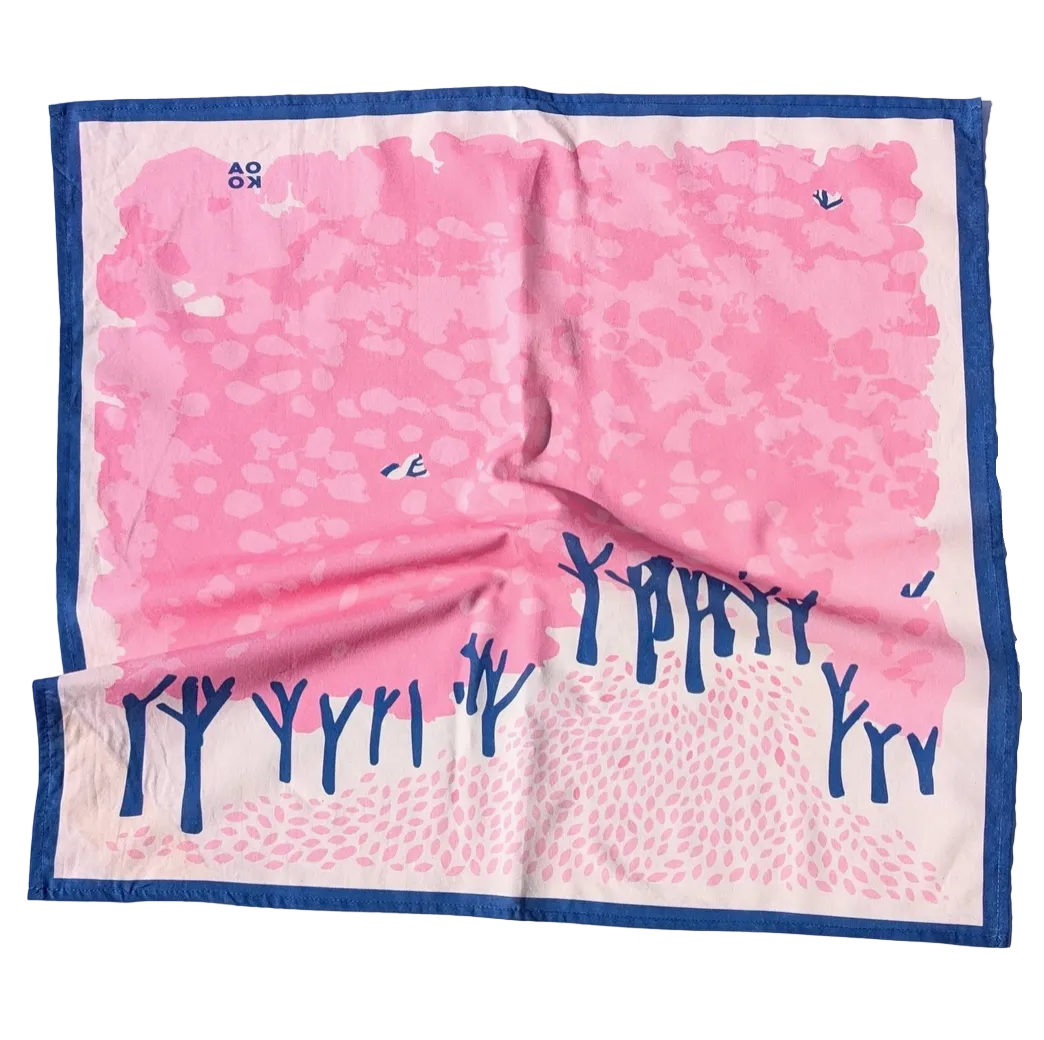 Pink and blue patterned bandana with tree design on a white background