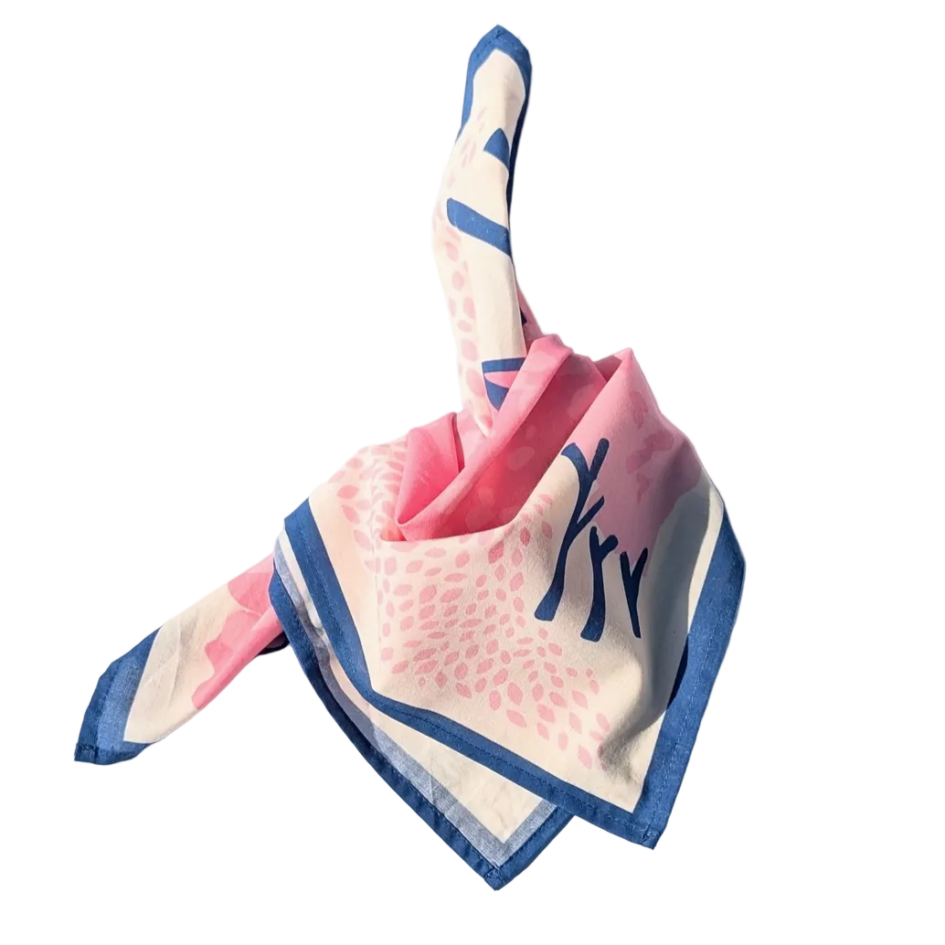 Pink and blue folded bandana on a white background