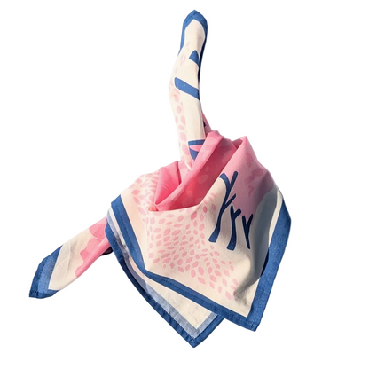 Pink and blue folded bandana on a white background