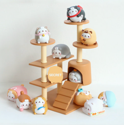 Wooden toy structure with small animal figurines on a white background.