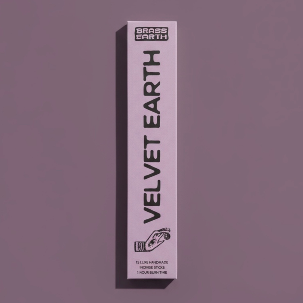 Velvet Earth Incense product packaging on a purple background