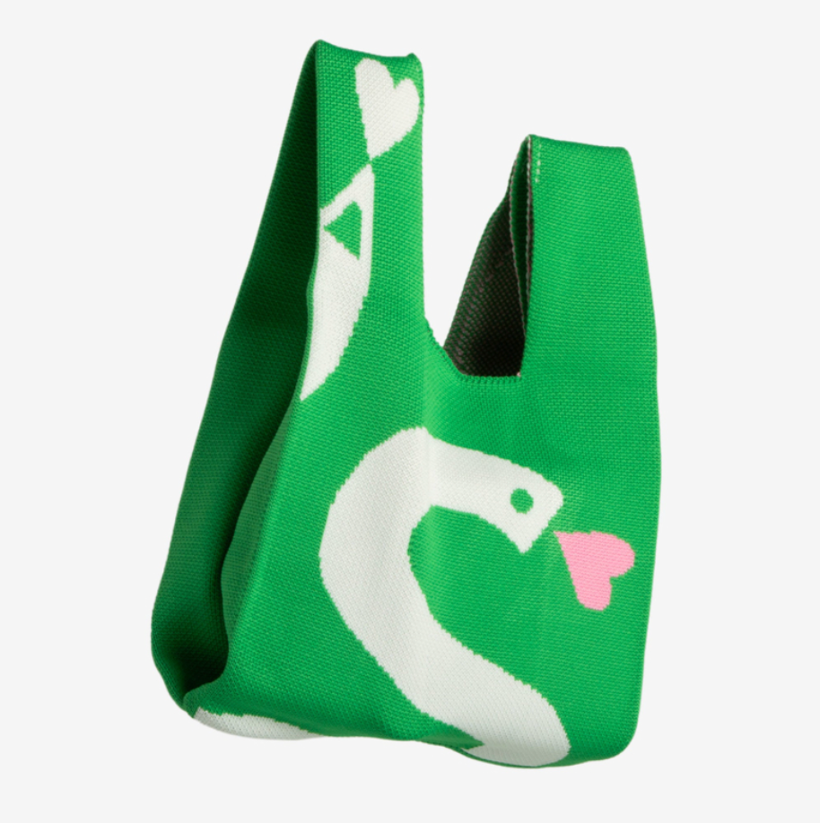 Green Knitted Knot Bag with white snake design on a light gray background