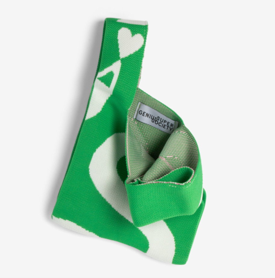 Green and white patterned product with a visible brand label on a light gray background