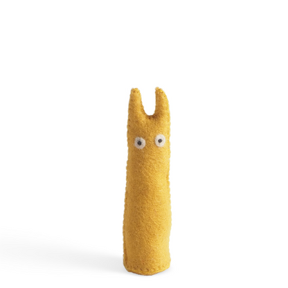 Yellow plush figure with googly eyes on a white background