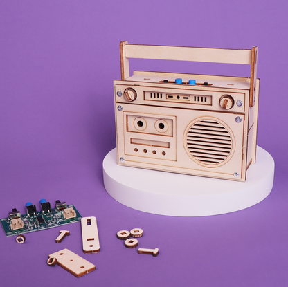 Wooden radio model kit on a purple background
