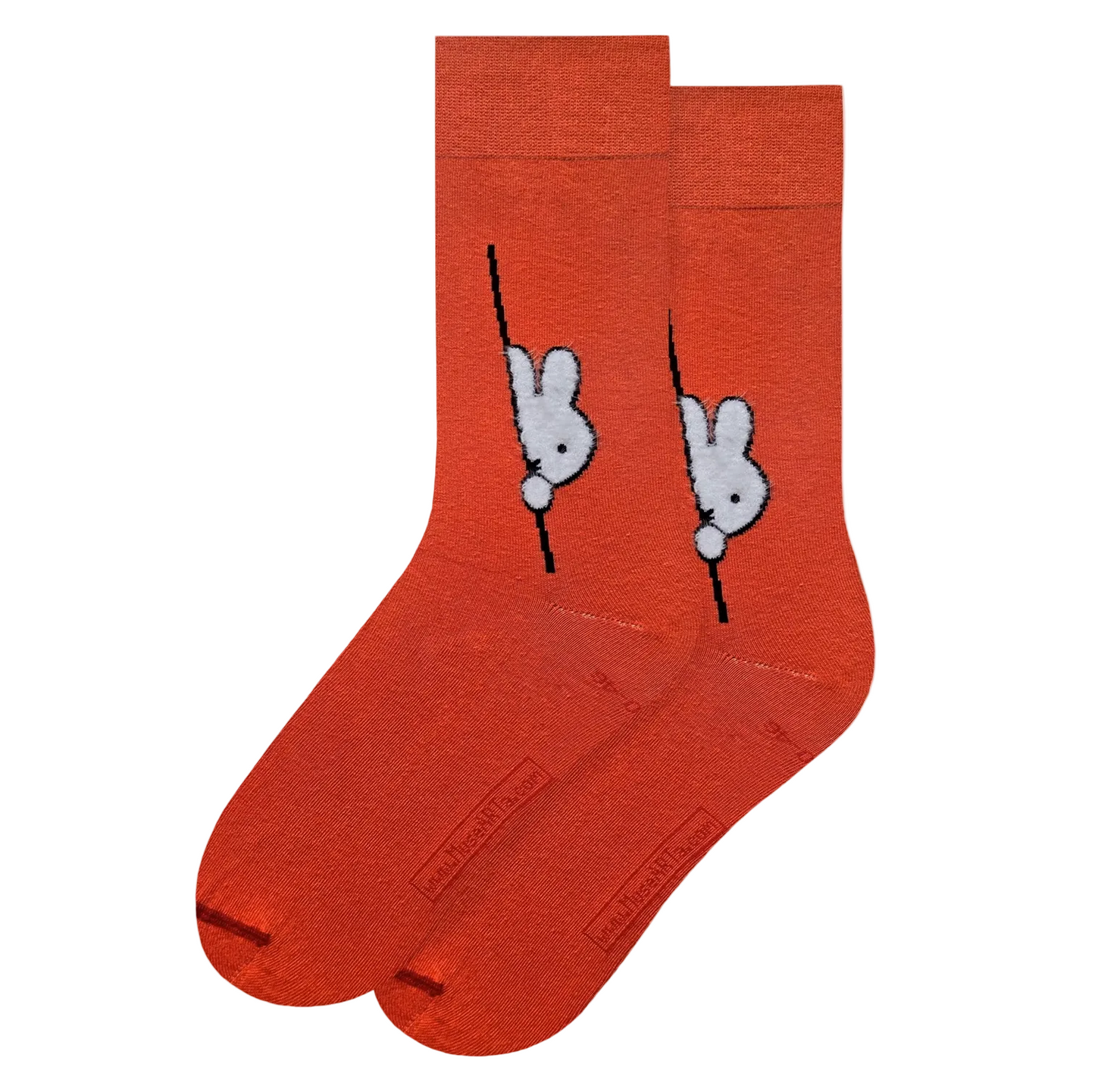 Orange socks with Miffy character design on a light gray background.