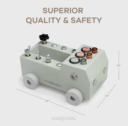 Toy truck with colorful buttons and wheels, labeled 'comfy Cubs', on a light gray background.