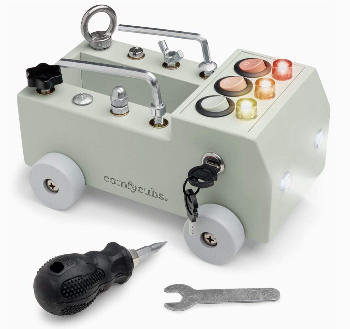 Toy construction set with wheels, tools, and colorful components on a white background