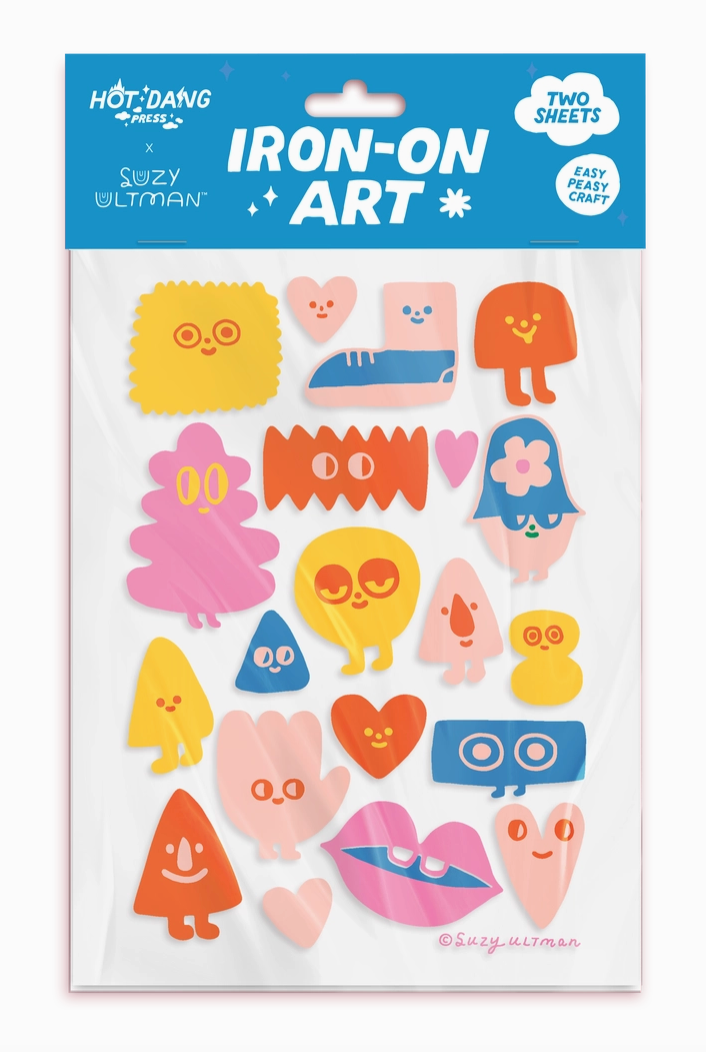 Package of colorful iron-on art decals with a blue label.
