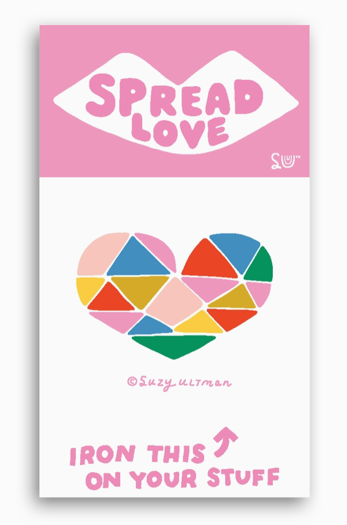 Iron-on label with geometric heart design and 'Spread Love' text on a pink background