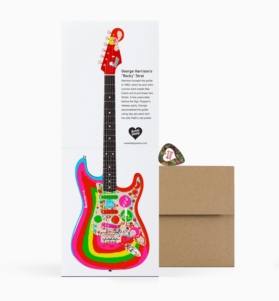 Colorful guitar-shaped card with a envelope on a white background