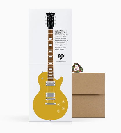 Guitar greeting card with a guitar pick on a white background