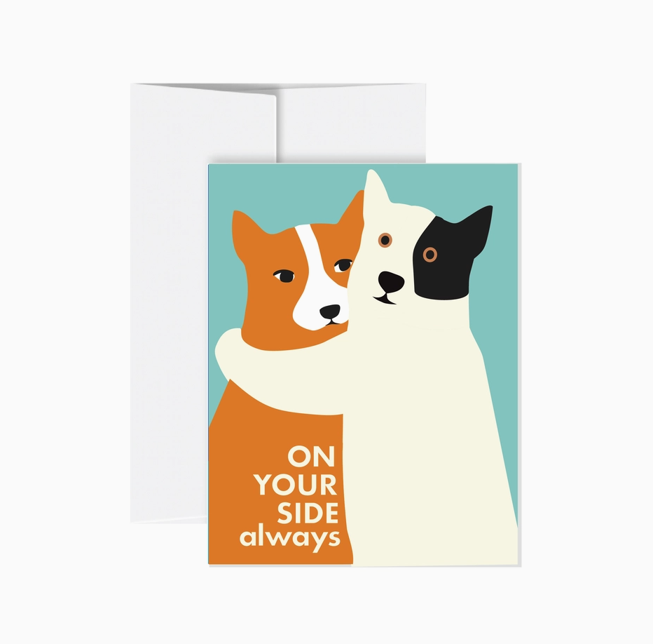 A notecard with two dogs hugging, text says "On Your Side Always".