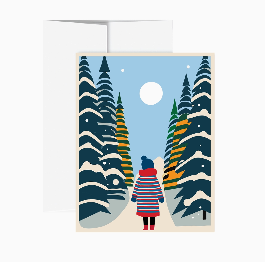 A square greeting card with a white envelope behind it, featuring a stylized winter forest illustration. The card shows a person in a red, blue, and white striped coat standing on a snowy path between tall pine trees under a pale blue sky and a white moon.