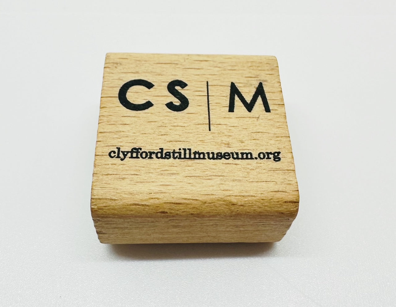 Top view of pencil sharpener with CSM logo