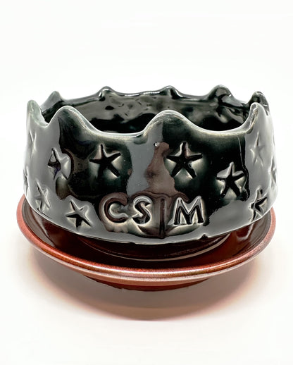 Handmade ‘Bowl Planter with Saucer’ with CSM logo and black star texture.