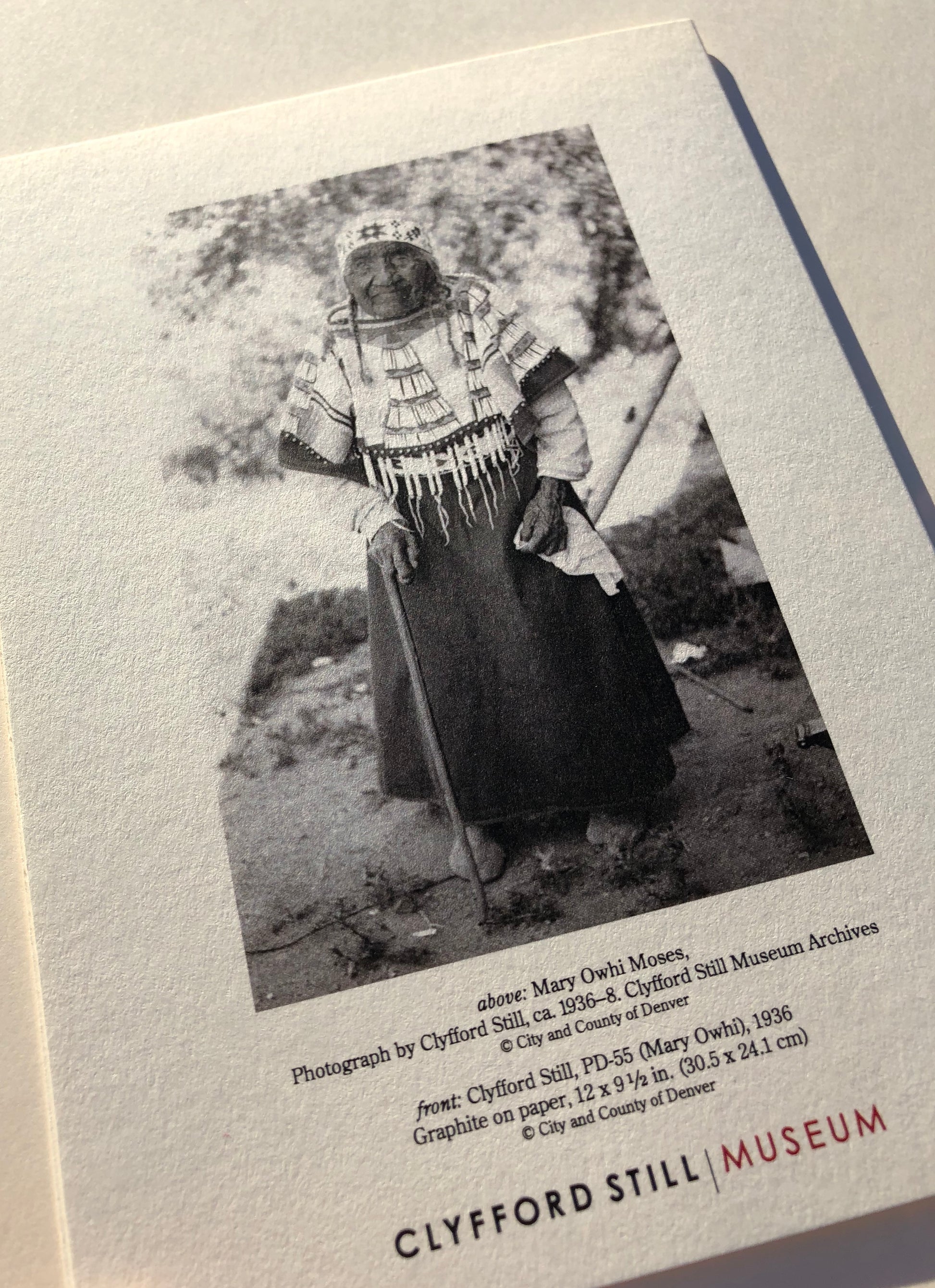 Limited edition post card featuring a photograph on the back, taken by Clyfford Still, of Mary Owhi Moses.