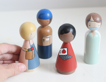 Wooden Essential Worker Dolls: A clerk, a delivery person, a teacher, and a healthcare worker